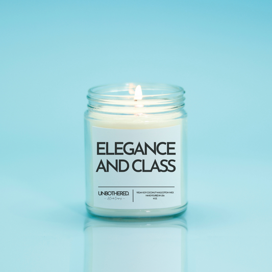 Elegance And Class Candle from the Unbothered Candle Co. Available in two Limited Edition Scents Pine Tree*, Holly Berry*, and two signature scents Cinnamon Roll and Vanilla Cookie. Vegan Soy Coconut Wax, 100% Cotton Wick, Hand-poured in the USA, Eco-friendly, non-toxic, no lead, no parabens, no synthetic dyes, no phthalates, and NEVER tested on animals.