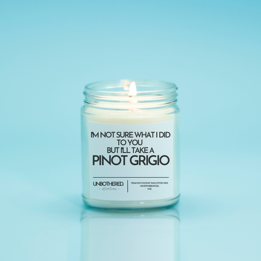 I'll Take a Pinot Grigio Candle from the Unbothered Candle Co. Available in two Limited Edition Scents Pine Tree*, Holly Berry*, and two signature scents Cinnamon Roll and Vanilla Cookie. Vegan Soy Coconut Wax, 100% Cotton Wick, Hand-poured in the USA, Eco-friendly, non-toxic, no lead, no parabens, no synthetic dyes, no phthalates, and NEVER tested on animals.