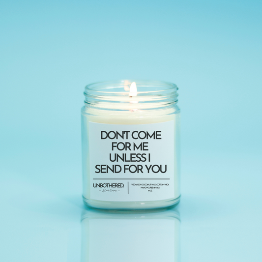 Don't Come For Me Unless I Send For You Candle from the Unbothered Candle Co. Available in two Limited Edition Scents Pine Tree*, Holly Berry*, and two signature scents Cinnamon Roll and Vanilla Cookie. Vegan Soy Coconut Wax, 100% Cotton Wick, Hand-poured in the USA, Eco-friendly, non-toxic, no lead, no parabens, no synthetic dyes, no phthalates, and NEVER tested on animals.
