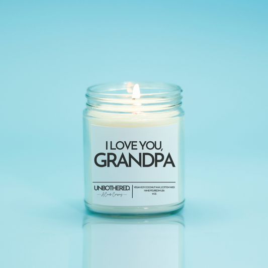 I Love You Grandpa Candle from the Unbothered Candle Co. Available in two Limited Edition Scents Pine Tree*, Holly Berry*, and two signature scents Cinnamon Roll and Vanilla Cookie. Vegan Soy Coconut Wax, 100% Cotton Wick, Hand-poured in the USA, Eco-friendly, non-toxic, no lead, no parabens, no synthetic dyes, no phthalates, and NEVER tested on animals.